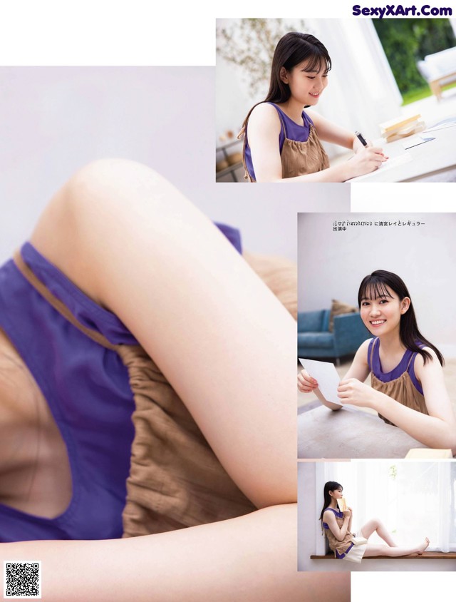A woman in a purple tank top sitting on a couch.
