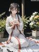 A woman in a white kimono sitting on a wooden deck.