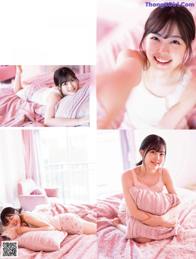 A woman laying on top of a bed holding a pillow.